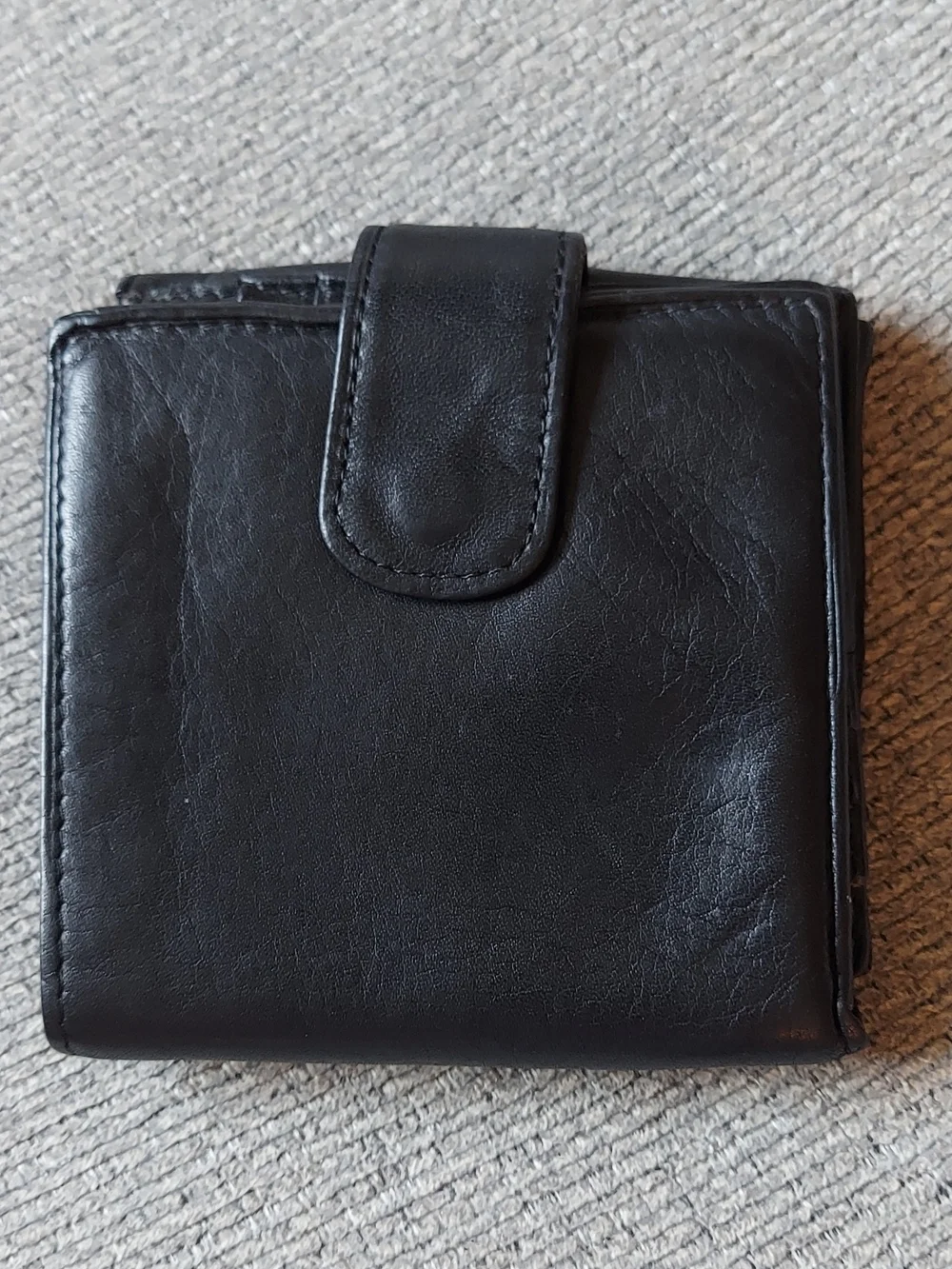 Tignanello Black Leather Bi-Fold Wallet with Gold Plaque